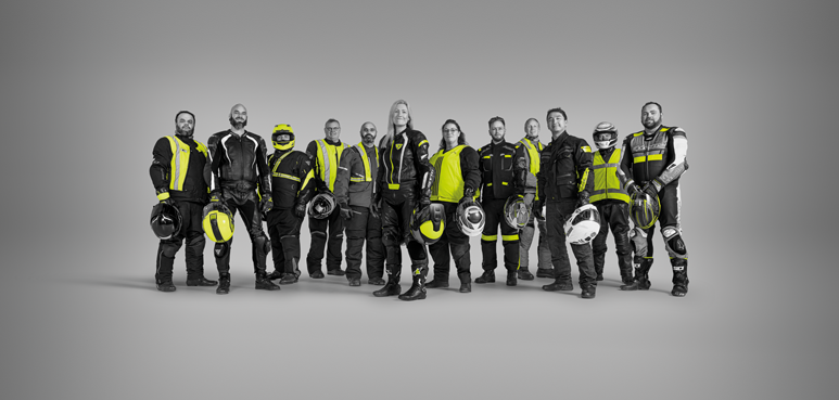 Superbike champion Andrew Stroud standing next to bike.