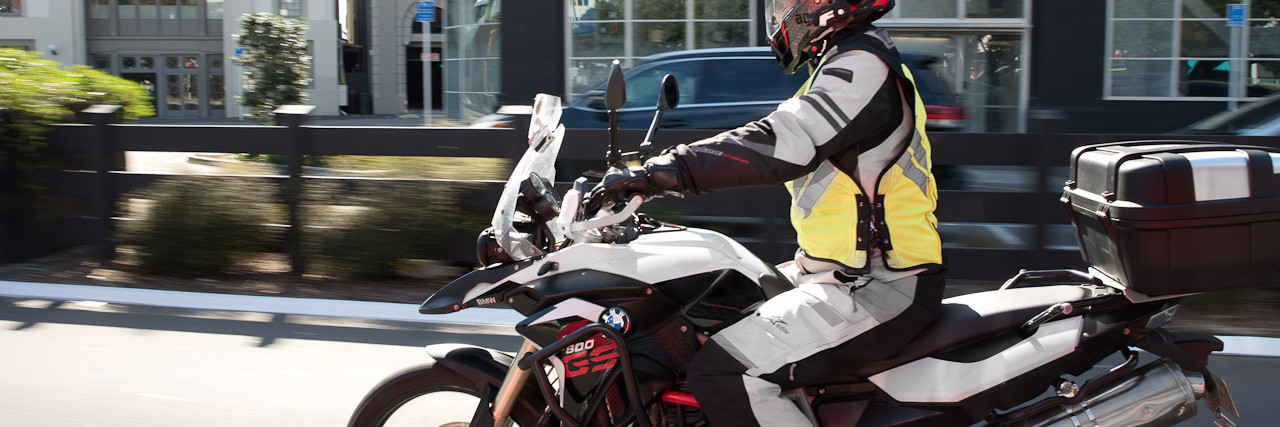 Action shot of person riding bike through urban area
