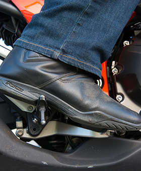 Close up of foot on brake