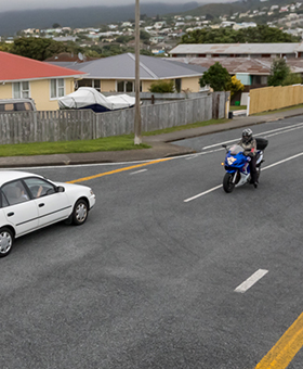 Bike waiting to turn right with oncoming traffic