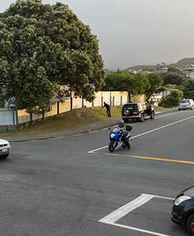 Bike waiting to turn right into main flow of traffic