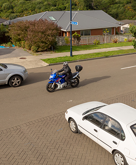 Bike riding with traffic waiting to turn