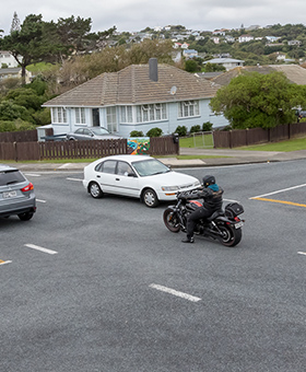 Bike waiting to turn right with oncoming traffic