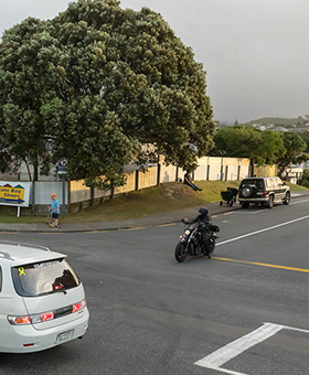 Bike waiting to turn right into main flow of traffic