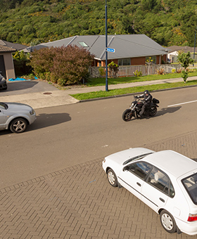 Bike riding with traffic waiting to turn