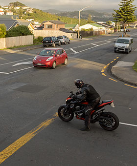 Bike waiting to turn right into main flow of traffic