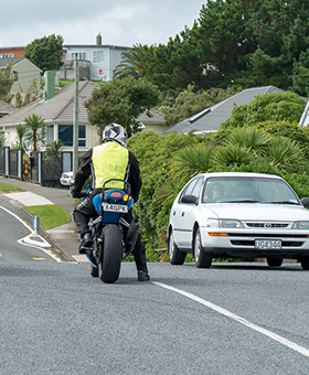Bike waiting to turn right with oncoming traffic