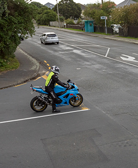 Bike waiting to turn right into main flow of traffic