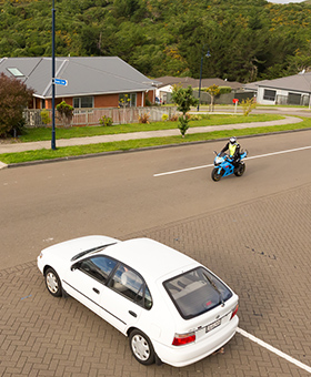 Bike riding with traffic waiting to turn
